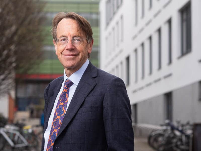 Professor Sir Rory Collins stands outside building