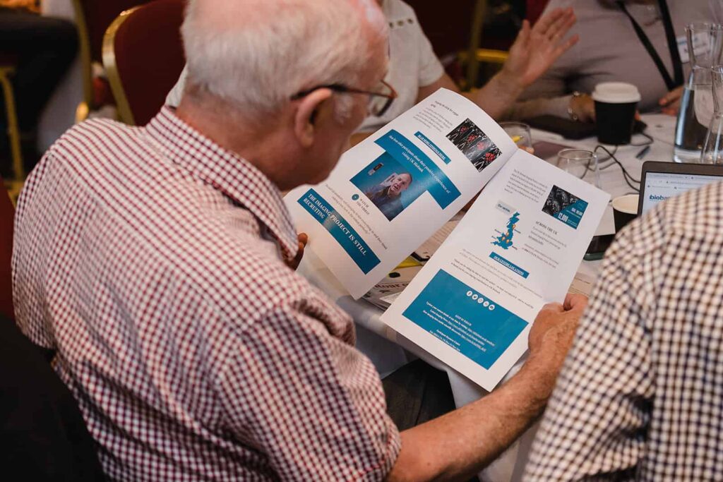 A man looks like a UK Biobank branded leaflet